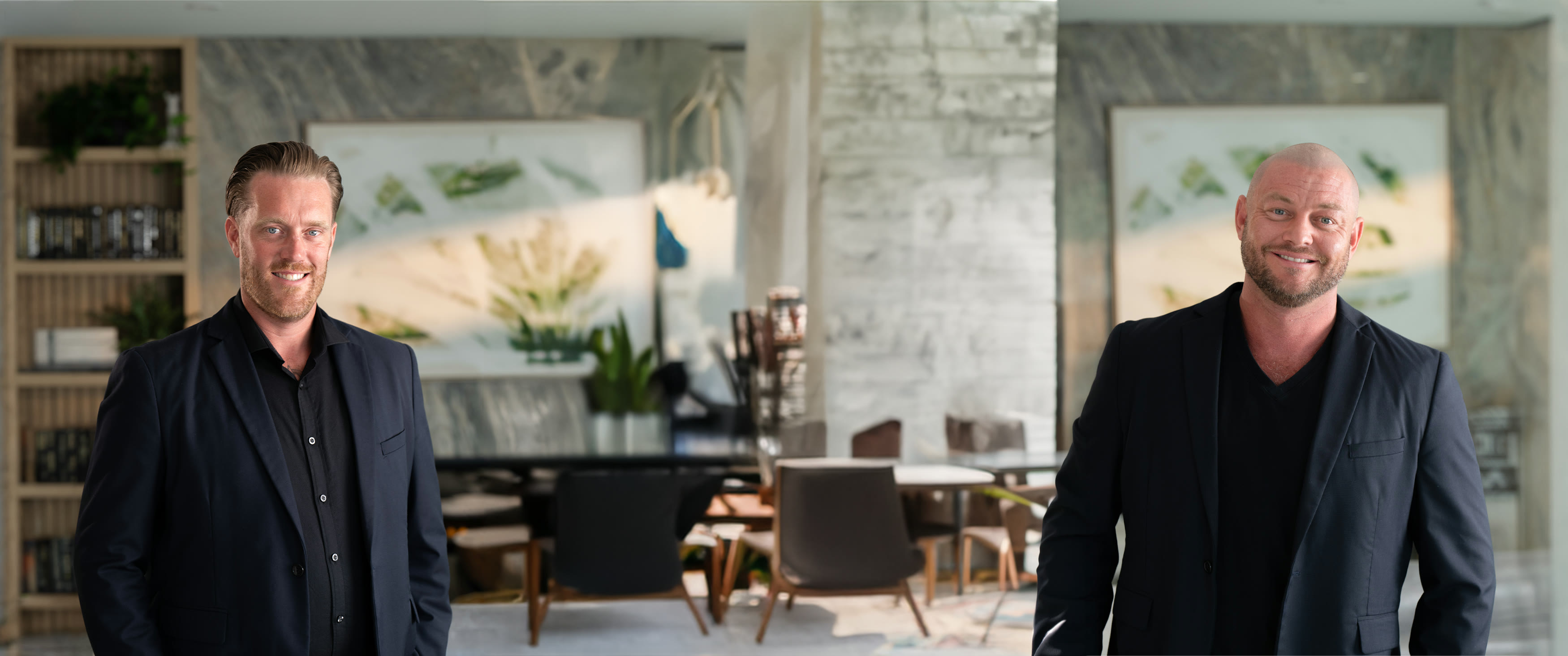 Ryan Featherstone and Paul Sadler in a bright, modern office