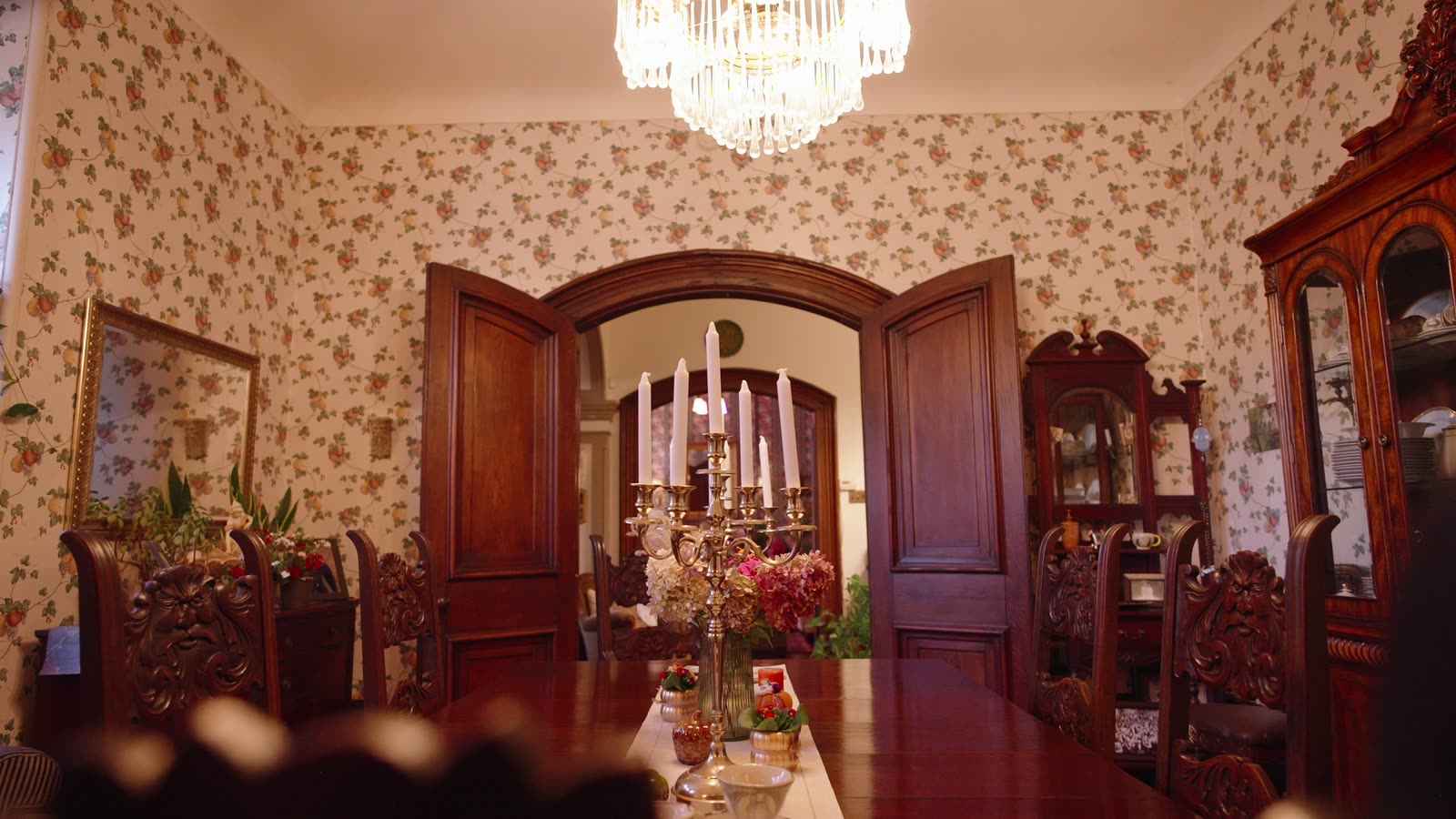 Tall wooden double doors and an arched doorway off the dining room at Inverlorne